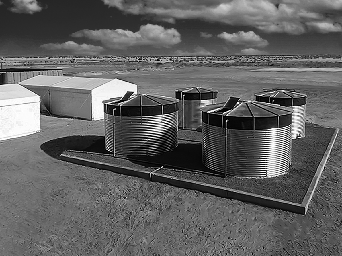 Old Black and white photo of steel water tanks depicting history