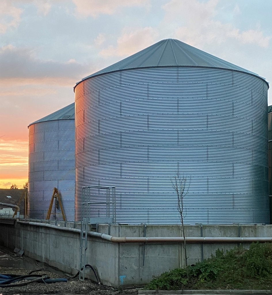 Photo of steel tanks and a sunset