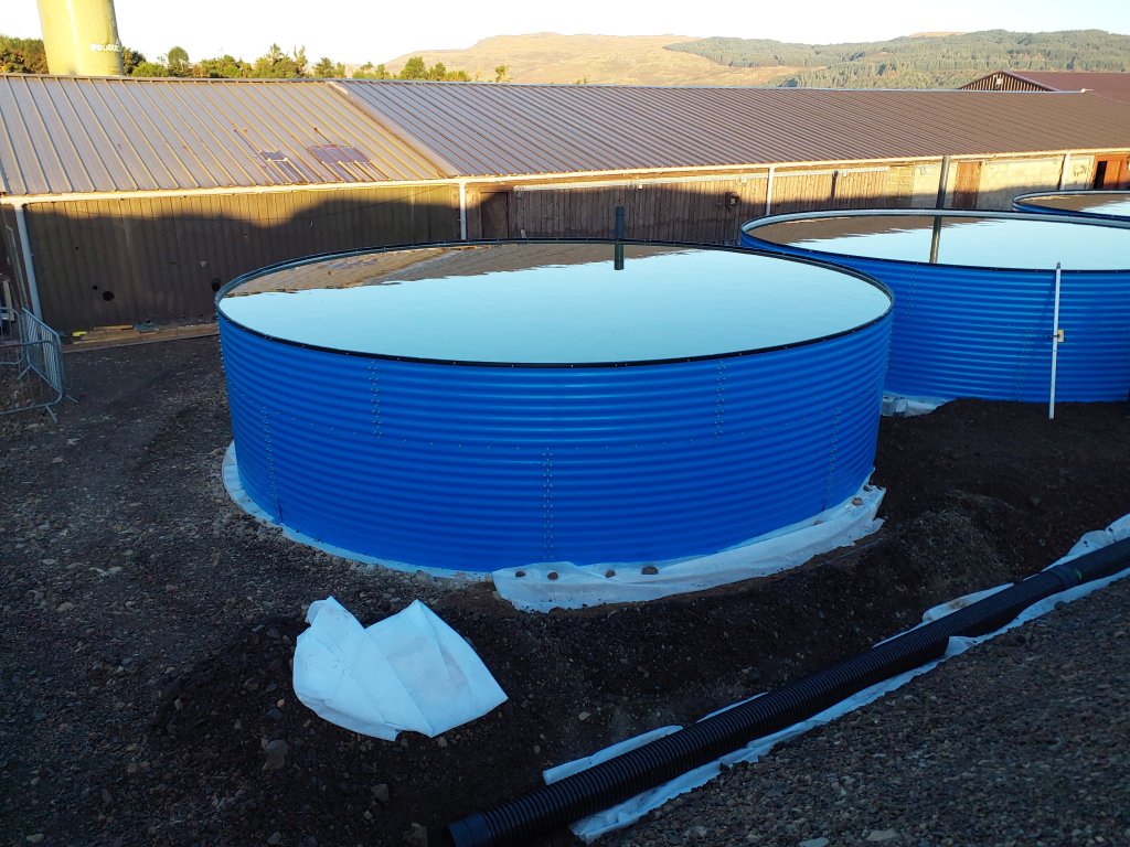 Blue water storage tank installation at site